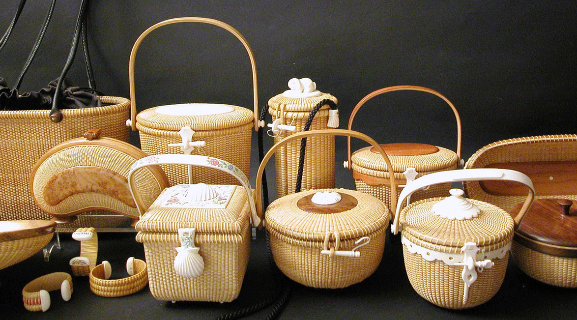 Collection of woven basket handbags with various handles and designs on a dark background.