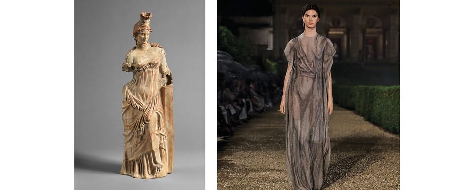 Ancient Greek sculpture of a woman and a modern fashion model in a long dress walking on a runway at night.