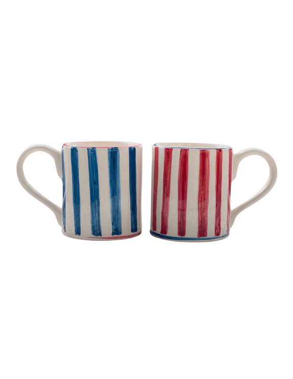 Two ceramic mugs with vertical blue and red stripes, each featuring a wide handle, placed side by side on a white background.