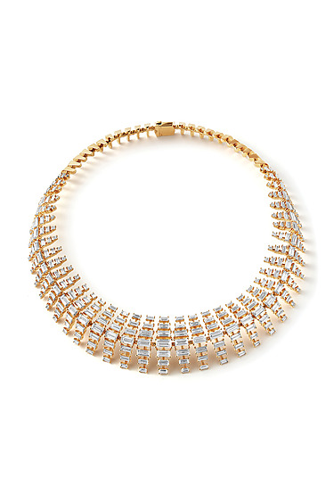 Gold choker necklace with intricate geometric design and sparkling embellishments on white background.