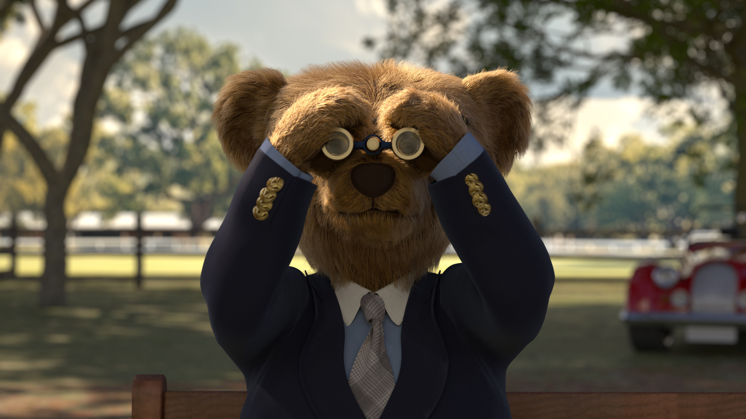 Bear in a suit covering eyes with hands, seated outdoors with trees and a vintage car in the background.