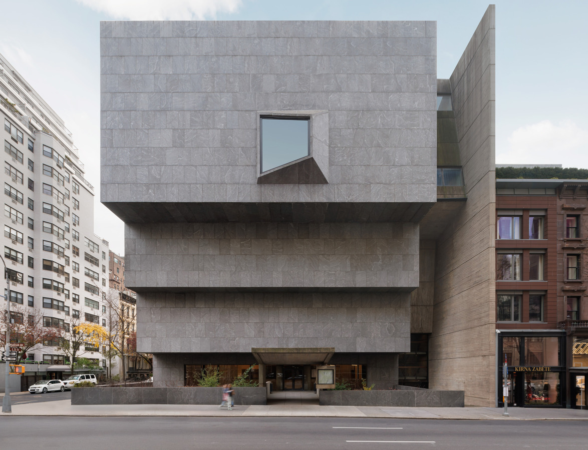 Museum building with a modern architectural design featuring a unique geometric facade, located in an urban setting.