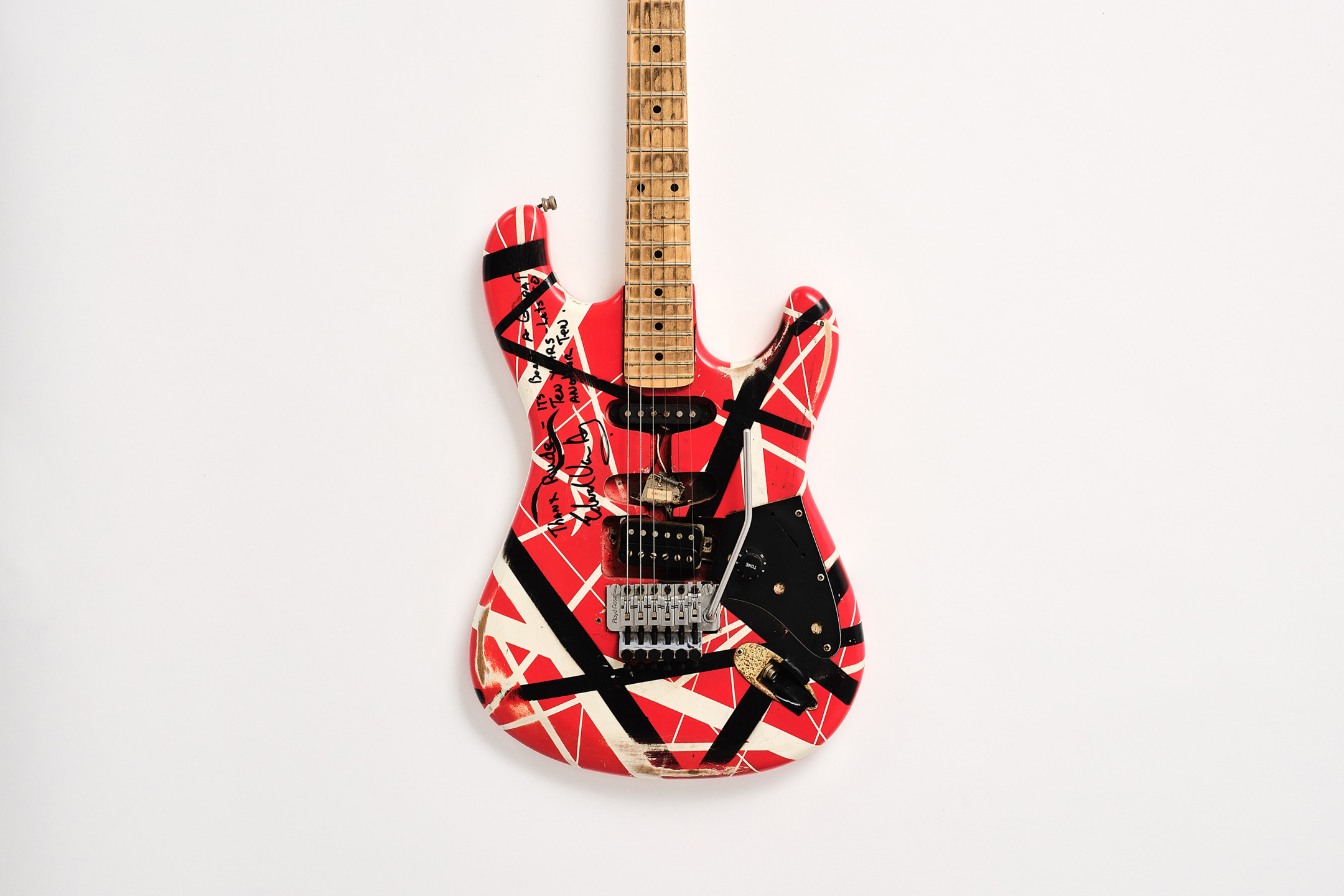 Red and white electric guitar with black stripes, Maple neck on a plain white background.