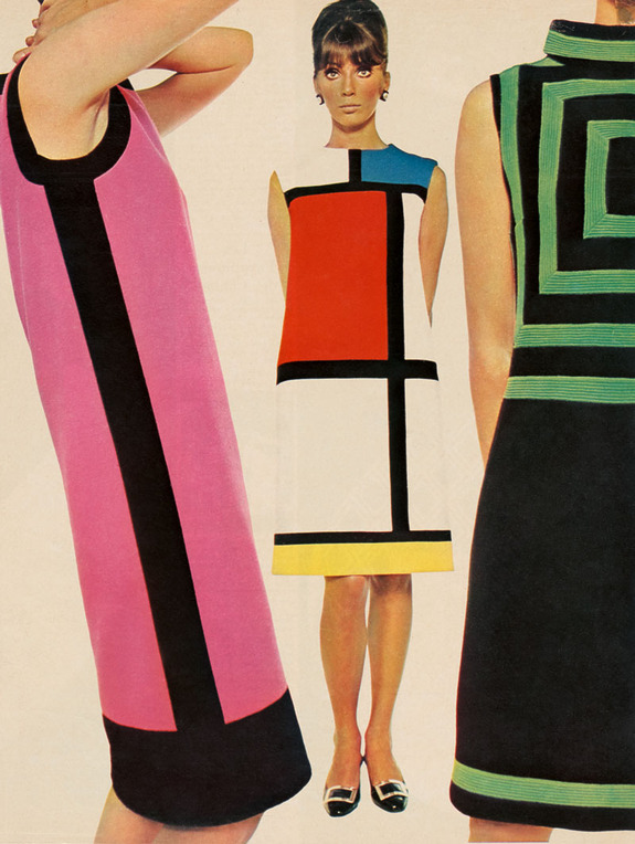 Three women wearing 1960s mod dresses with bold geometric patterns and vibrant colors, standing against a beige background.