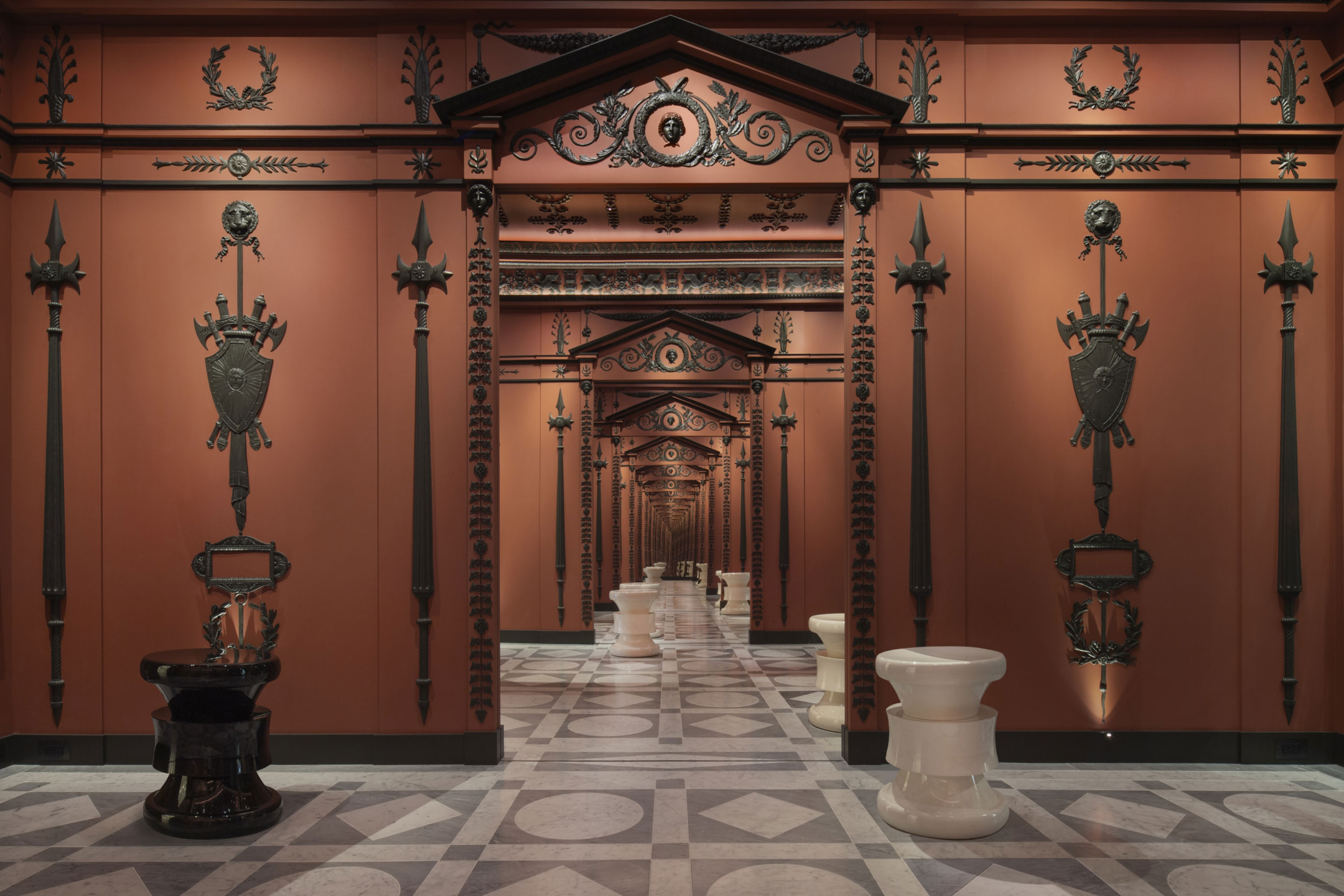 Ornate hallway with intricate designs, symmetrical decor, warm lighting, and reflection creating a captivating visual depth.