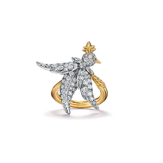Detailed bird-shaped ring with sparkling diamonds on a gold band.