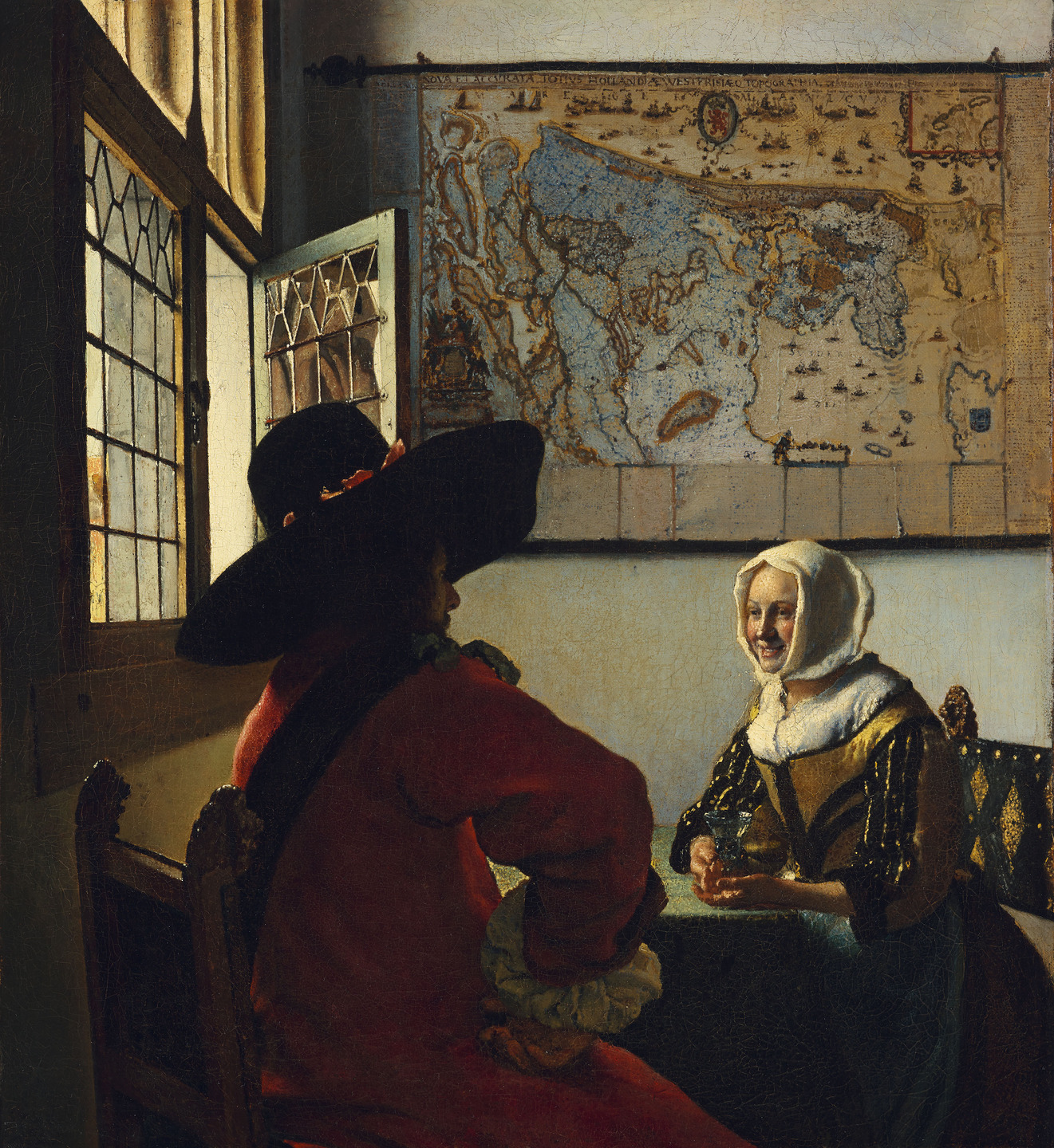 A painting of a man and a woman seated at a table, looking at each other, with a large map on the wall behind them.