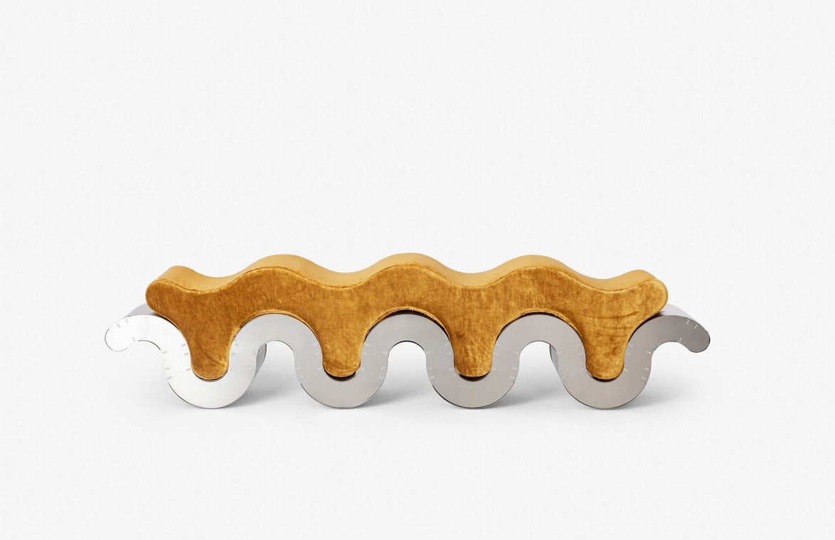 Wood and metal wavy sculpture with interlocking elements on a plain white background.