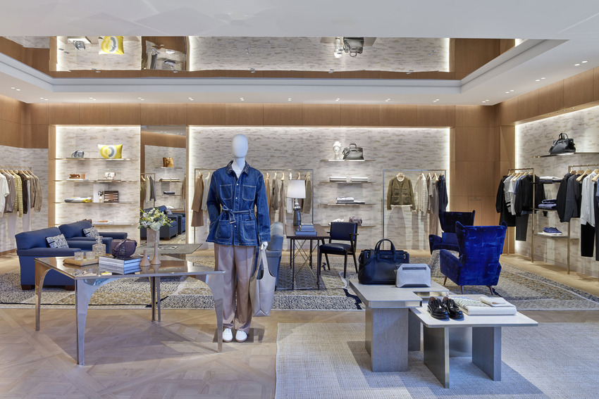 luxury clothing store interior with stylish displays mannequins elegant seating area and well-organized shelves and racks