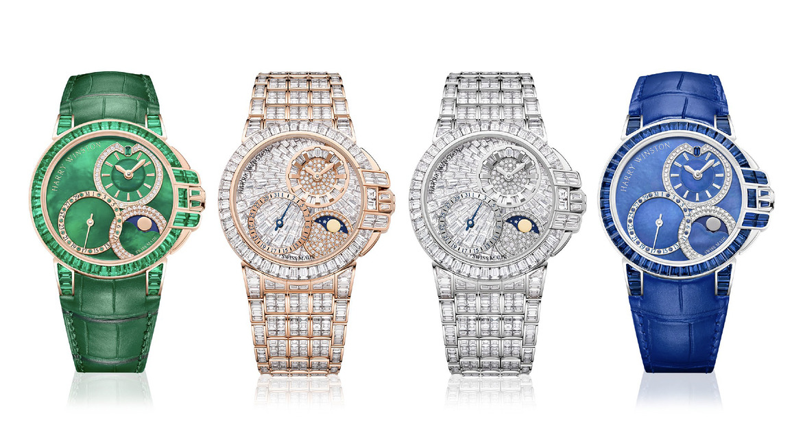 Four luxury watches in green, gold, silver, and blue with intricate designs and gemstone embellishments displayed in a row.