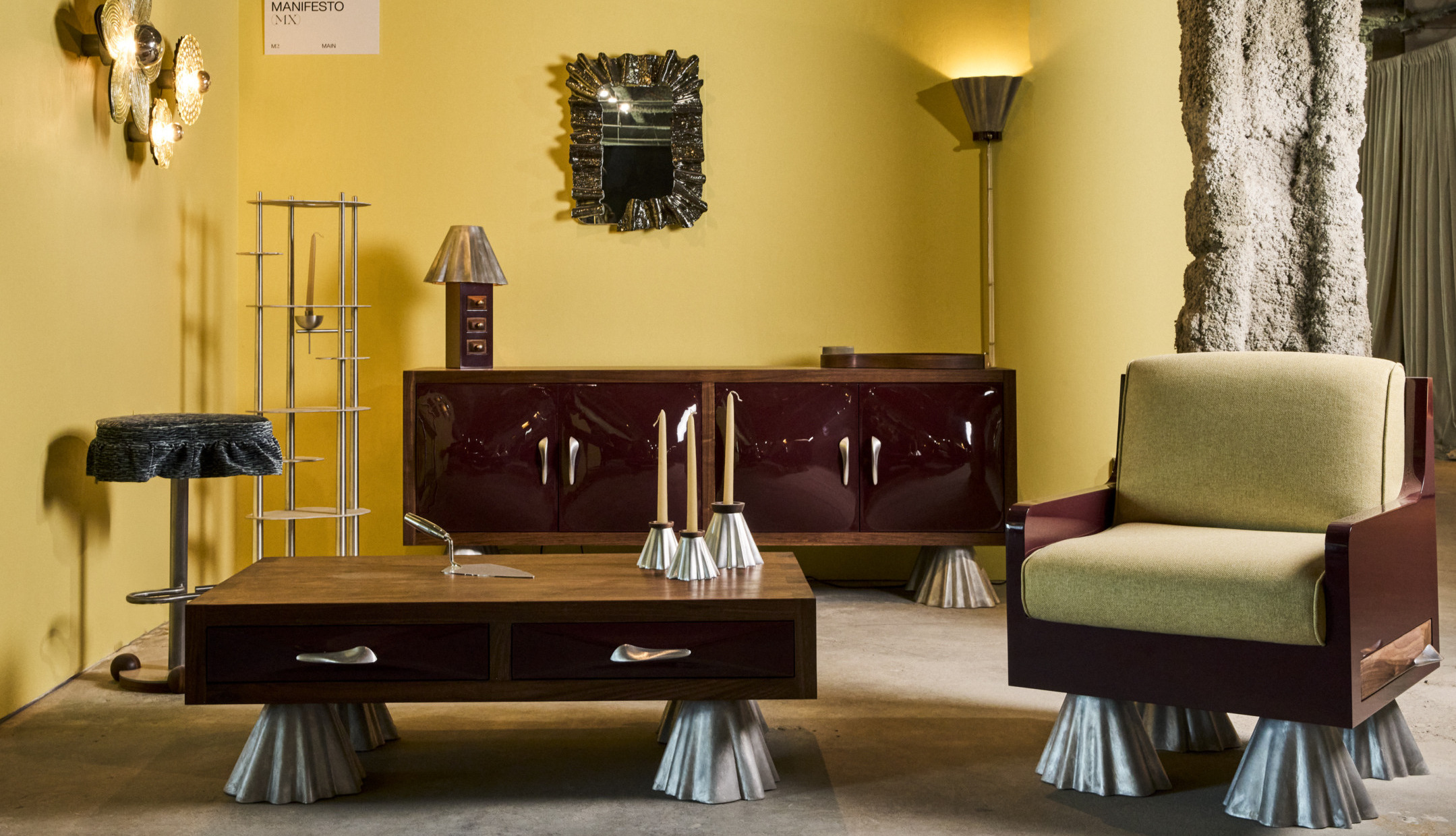 Mid-century modern furniture in a vintage room with yellow walls, featuring a chair, table, mirror, cabinet, and lamps.