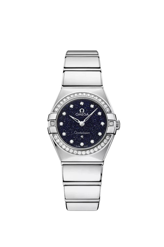 Luxury silver watch with a blue starry dial, diamond accents, and a link bracelet, showcasing elegance and craftsmanship.