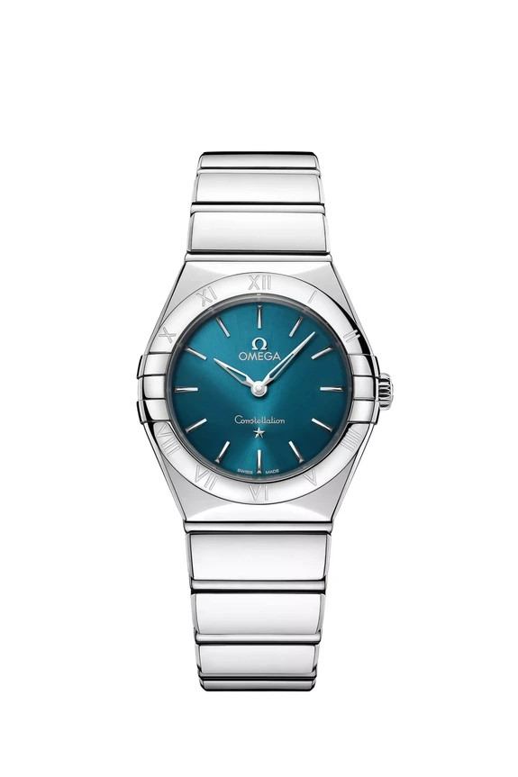 Silver watch with a teal face, featuring Roman numerals and a stainless steel strap, displaying the time at approximately 10:09.