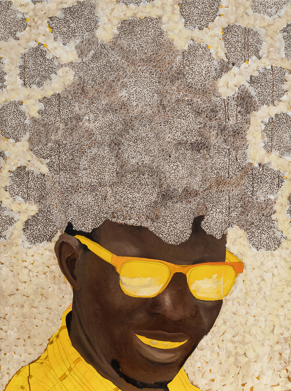 Portrait of a smiling person wearing yellow sunglasses and shirt with a textured, abstract background.