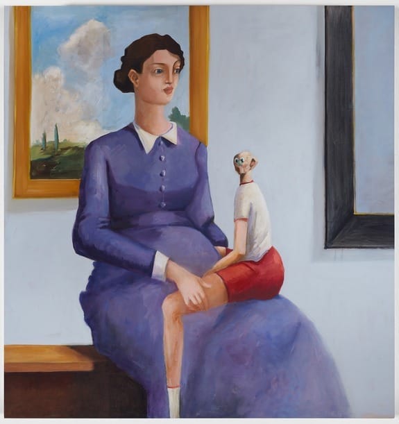 A woman in a purple dress seated with a small figure on her lap, in an art gallery setting with paintings on the wall.