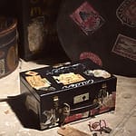 Vintage suitcase with travel stickers, lying on a floor with scattered travel tags around it.