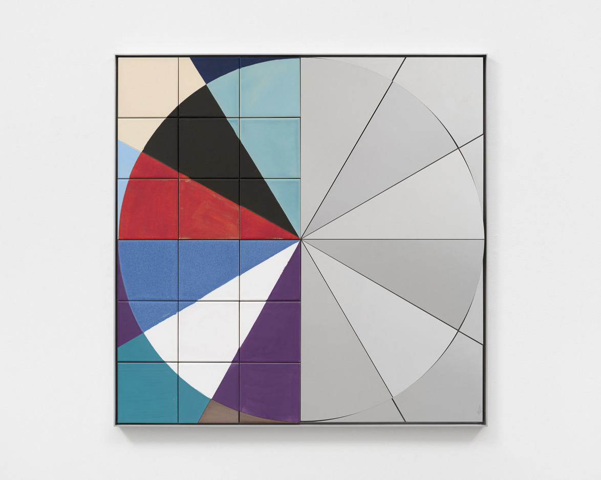 Abstract geometric painting with colorful pie chart design on the left, grayscale sections on the right, framed on a white wall.