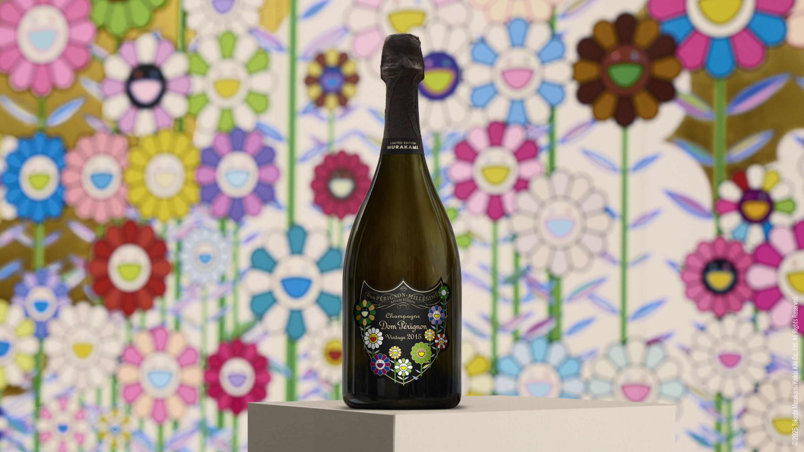 Bottle of champagne with colorful flower design standing in front of vibrant floral art background