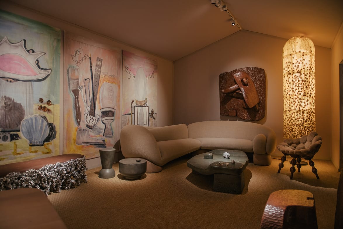 A cozy, modern living room with unique sculptures, abstract art, and contemporary furniture.