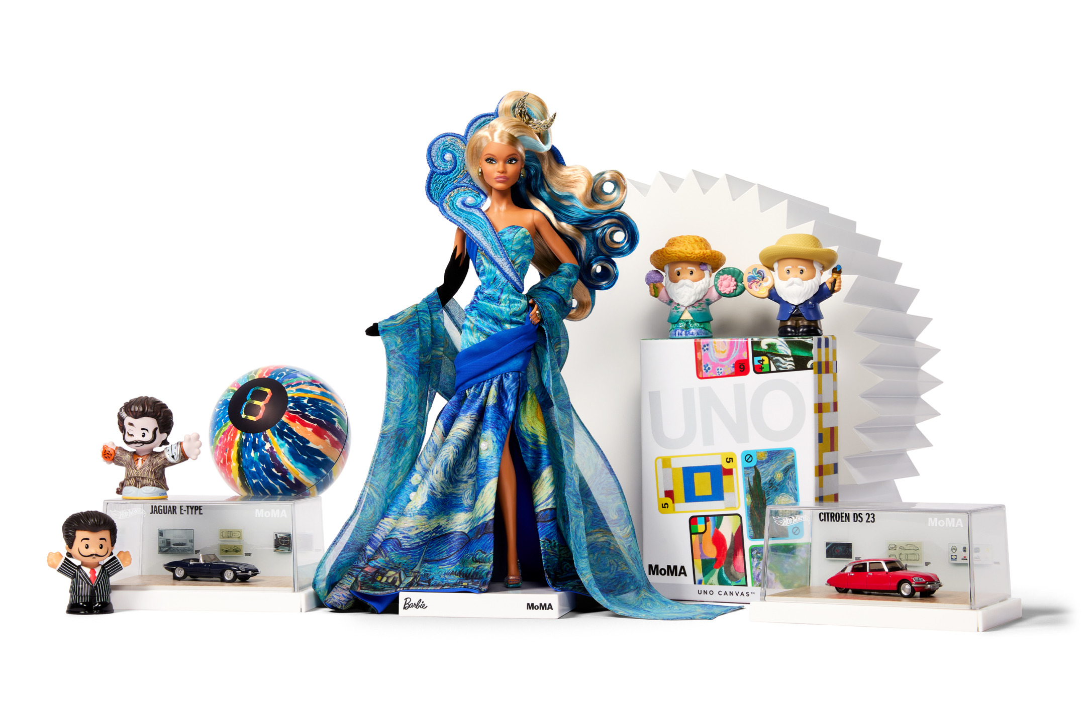 Colorful display of Barbie doll in blue dress, vinyl records, UNO game, toy cars, and various collectibles on a white background.