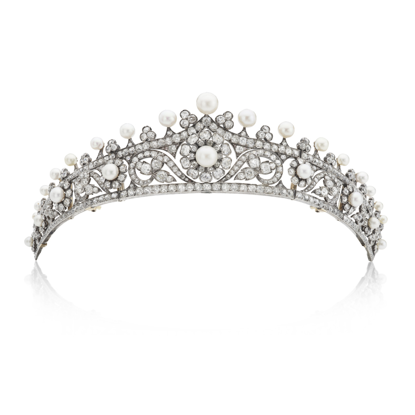 Elegant silver tiara adorned with pearls and diamonds against a white background.