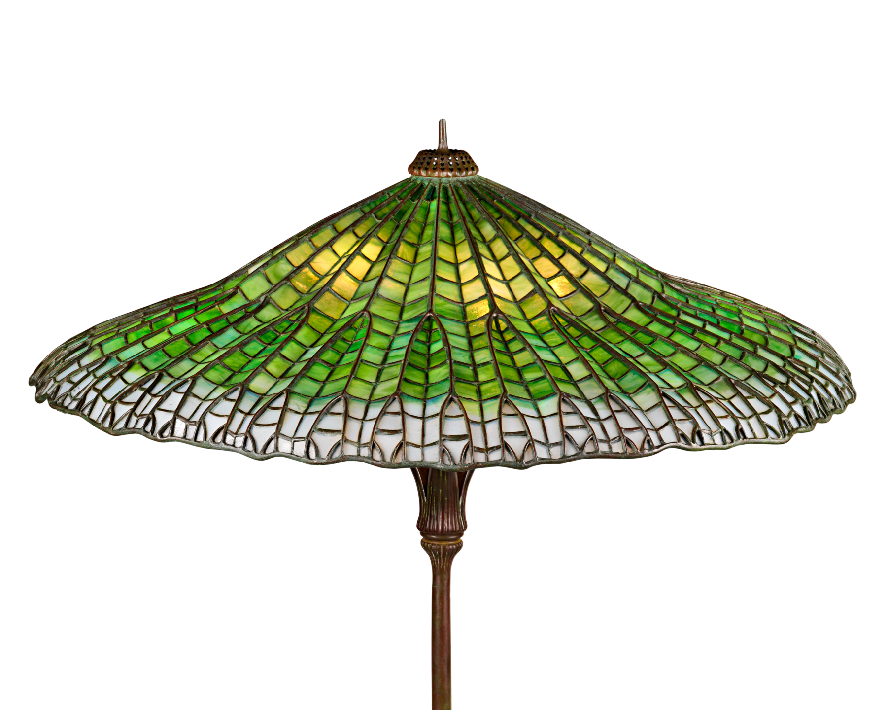 Green stained glass lampshade with intricate patterns on a vintage lamp base.