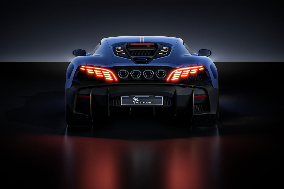 rear view of a sleek blue sports car with illuminated taillights on a dark reflective surface