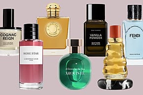 A collection of various perfume bottles arranged on a neutral background.