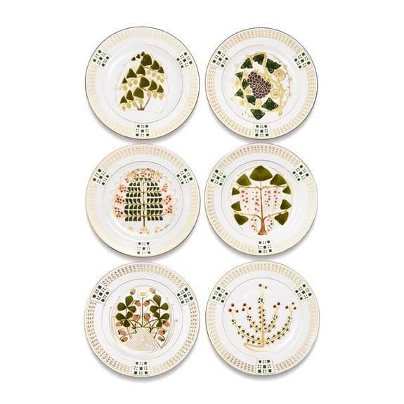 Six decorative plates with unique botanical designs arranged in two rows of three on a white background.