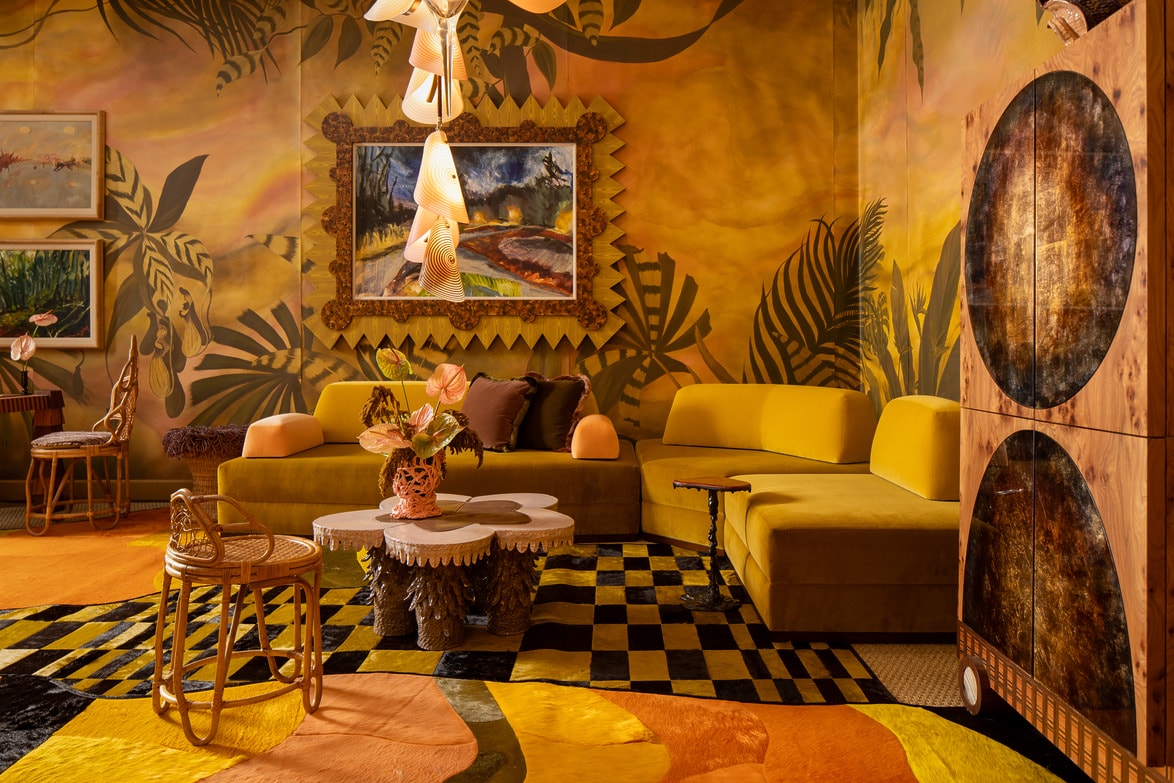 Vibrant retro-style living room with yellow sofa, patterned rug, unique lighting, and eclectic decor elements.