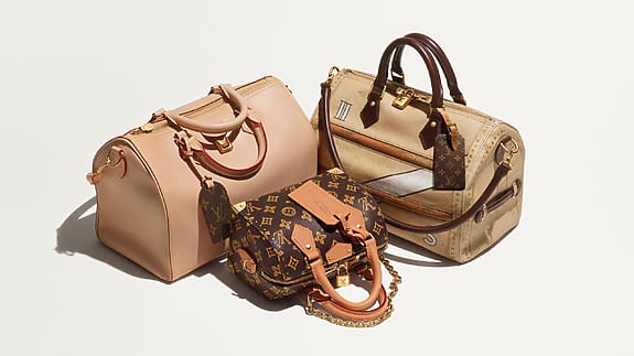 Three stylish designer handbags arranged together on a white background, featuring various colors and elegant detailing.