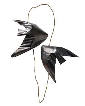 Abstract metal fish art sculpture with two fish shapes connected by a delicate chain, showcasing a modern design.