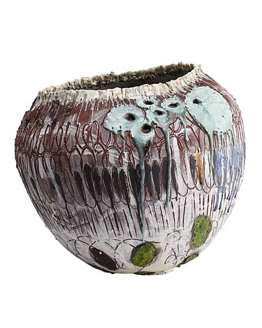 Ceramic vase with textured patterns, earthy tones, and artistic green and blue drips on the surface.