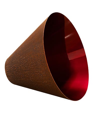 Rust-colored conical sculpture with a smooth, glossy red interior, positioned on its side against a white background.