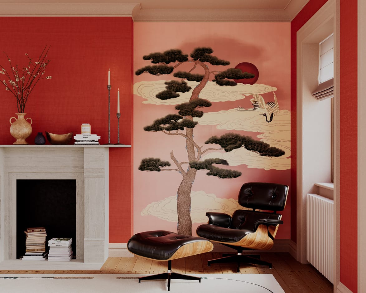 Modern living room with red walls, Eames lounge chair, fireplace, and a decorative mural featuring a tree and crane.
