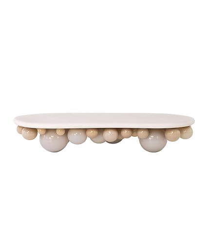 Modern white and beige bubble table with a unique design and rounded edges against a plain background.