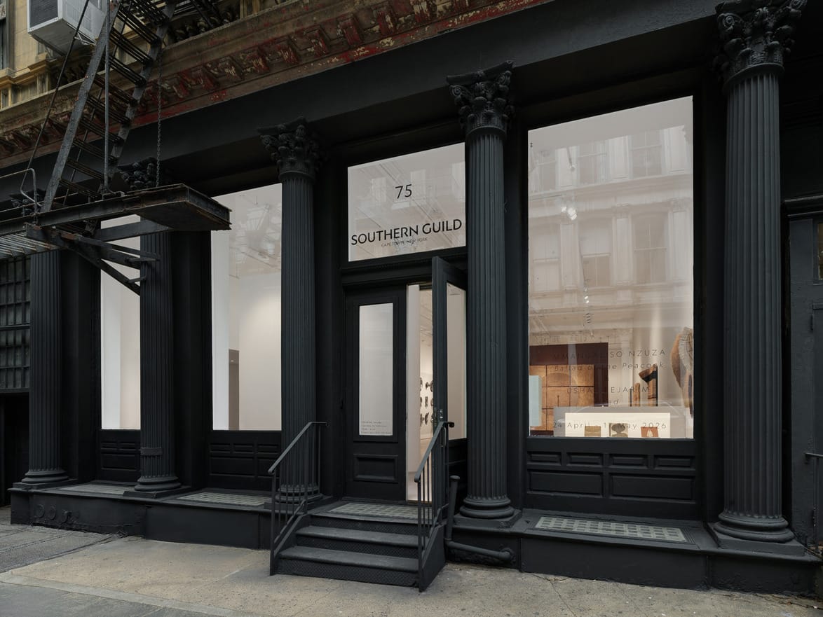 Exterior of Southern Guild gallery with black columns and large windows displaying art pieces.