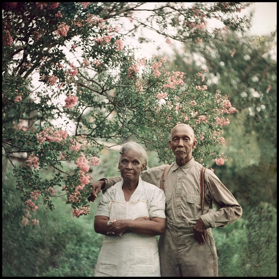 Gordon Parks portrait of an elderly couple standing under a blooming tree in a garden, on view at the Park Avenue Armory at AIPAD 2026.