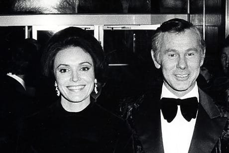 Joanna and Johnny Carson dressed in formal evening wear at a social event.