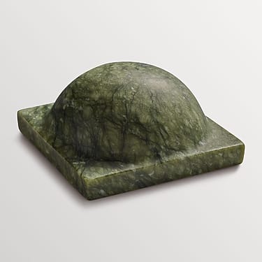 Green jade stone ink plate with dome-shaped center on a white background.