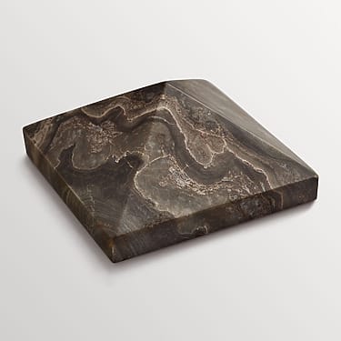 A polished, square-shaped piece of dark marble with intricate natural patterns on a light background.