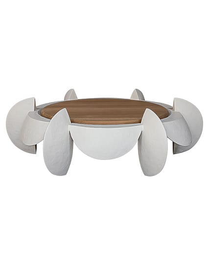 Modern circular coffee table with artistic white curved legs and a wooden top.