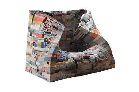 Strata of Illusion, 2025, by Jongjim Park: a colorful, abstractly textured armchair with a patchwork design and unique geometric shape.