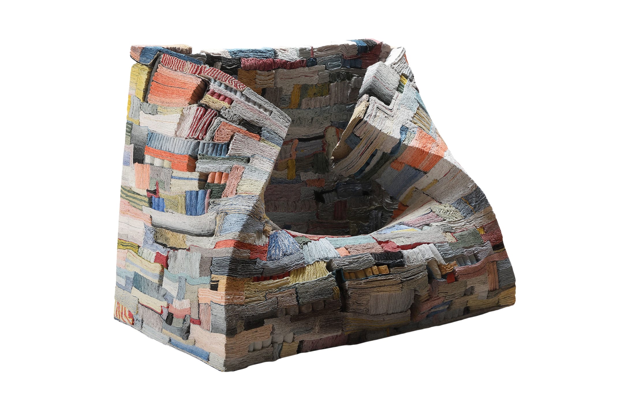 Strata of Illusion, 2025, by Jongjim Park: a colorful, abstractly textured armchair with a patchwork design and unique geometric shape.