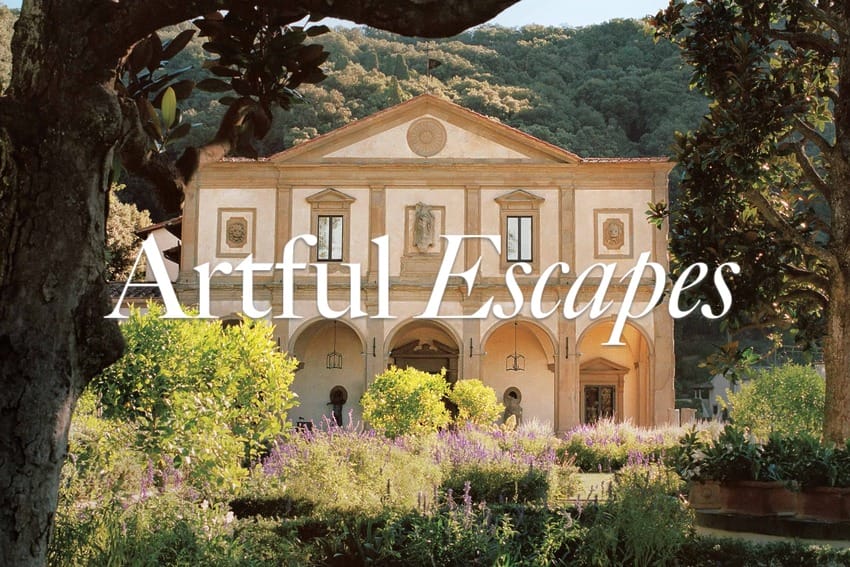 Historic villa surrounded by lush gardens and mountains with the words Artful Escapes displayed across the image.