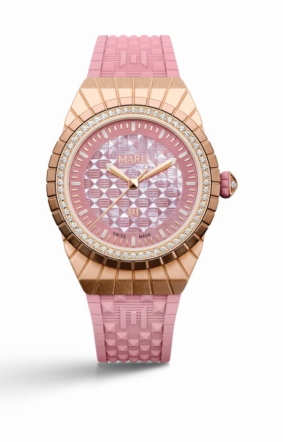 Luxury pink and gold wristwatch with textured strap and detailed geometric dial on a white background.